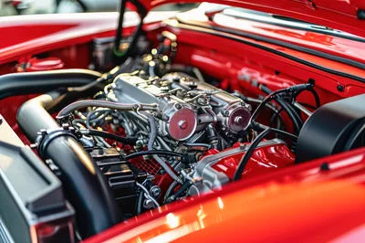 Detailed View Of A Classic Red Car Engine