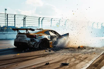 Damaged Yellow Sports Car Crashing On Racetrack