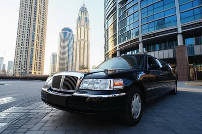 Black Stretch Limousine Parked in Modern Dubai Cityscape