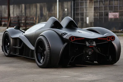 Matte Black Futuristic Supercar Parked Outdoors