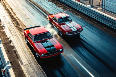Two Classic Muscle Cars Racing on Drag Strip