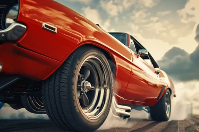 Red Muscle Car Performing A Burnout On Asphalt