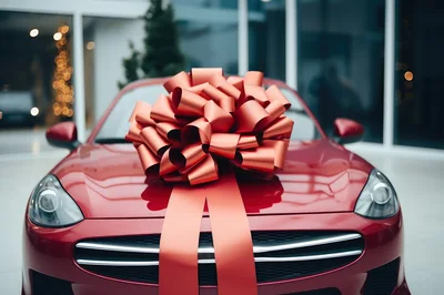 Red Sports Car With A Large Gift Bow