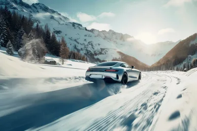 Silver Sports Car Drifting On Snowy Mountain Road