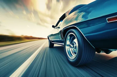 Classic Muscle Car Driving Fast On Open Highway