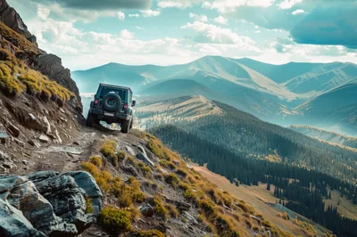 Off-Road Vehicle Driving On Narrow Mountain Ridge Trail