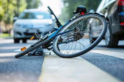 Fallen Bicycle Lying on a Pedestrian Crosswalk