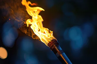 Burning Metal Torch With Bright Orange Flames