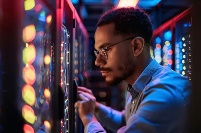 IT Technician Working In A High Tech Server Room