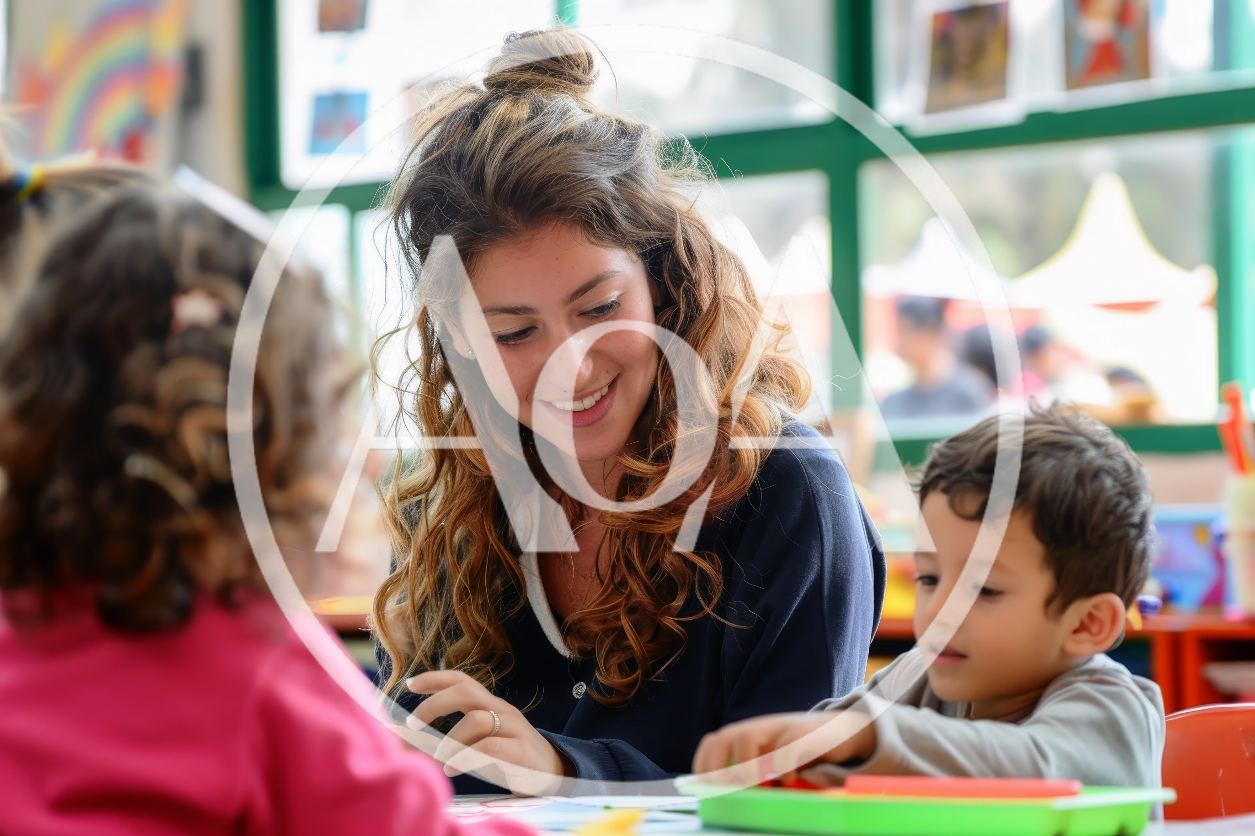 Preschool Teacher Helping Children With Classroom Activities