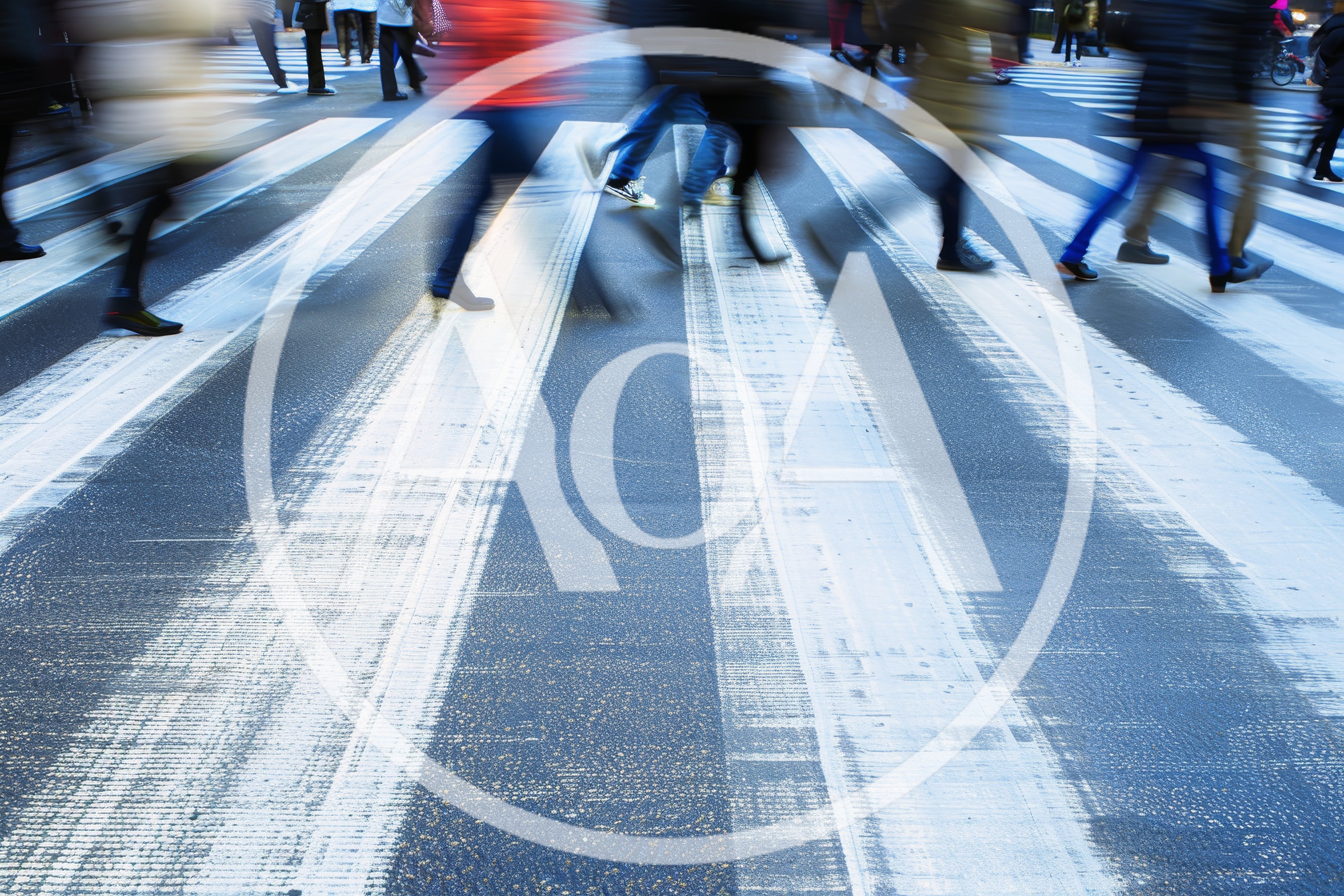 Blurred Pedestrians Crossing A Busy City Street