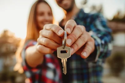 Happy Couple Holding New House Key