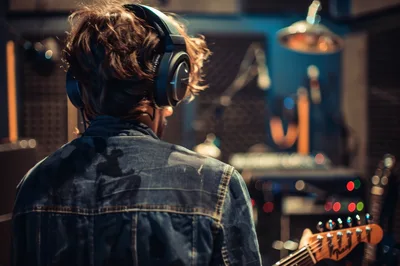Musician Playing Electric Guitar In A Professional Recording Studio