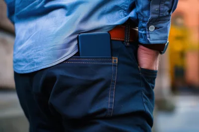 Man With Smartphone In Back Pocket Of Jeans