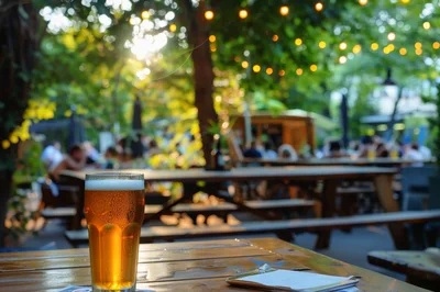 Glass Of Beer On A Wooden Table In A Beer Garden