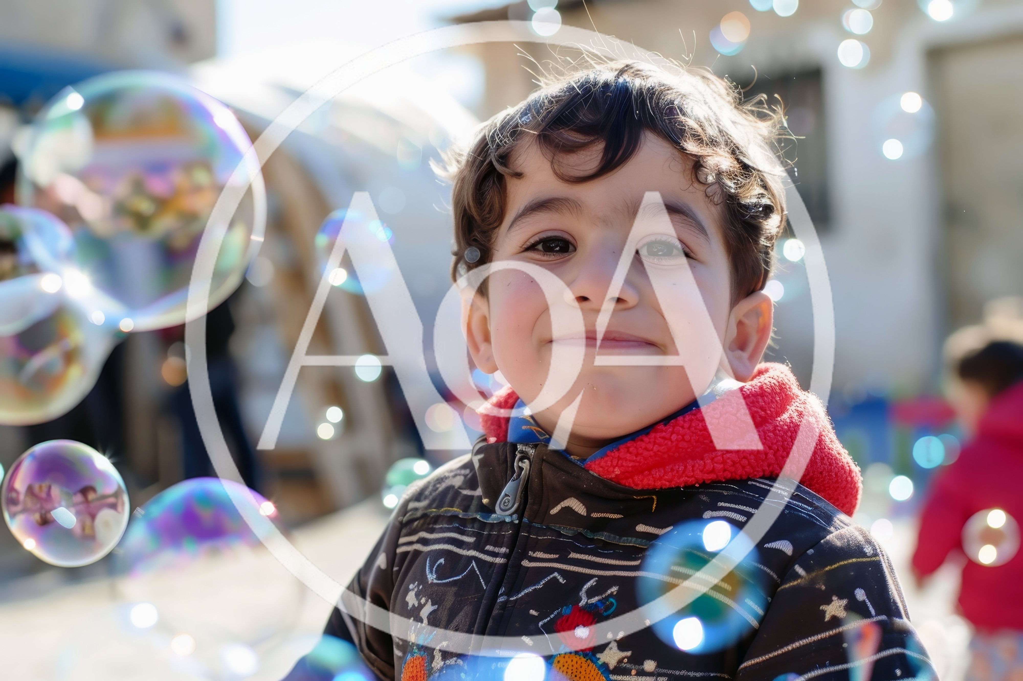 Happy Young Boy Playing With Bubbles Outdoors