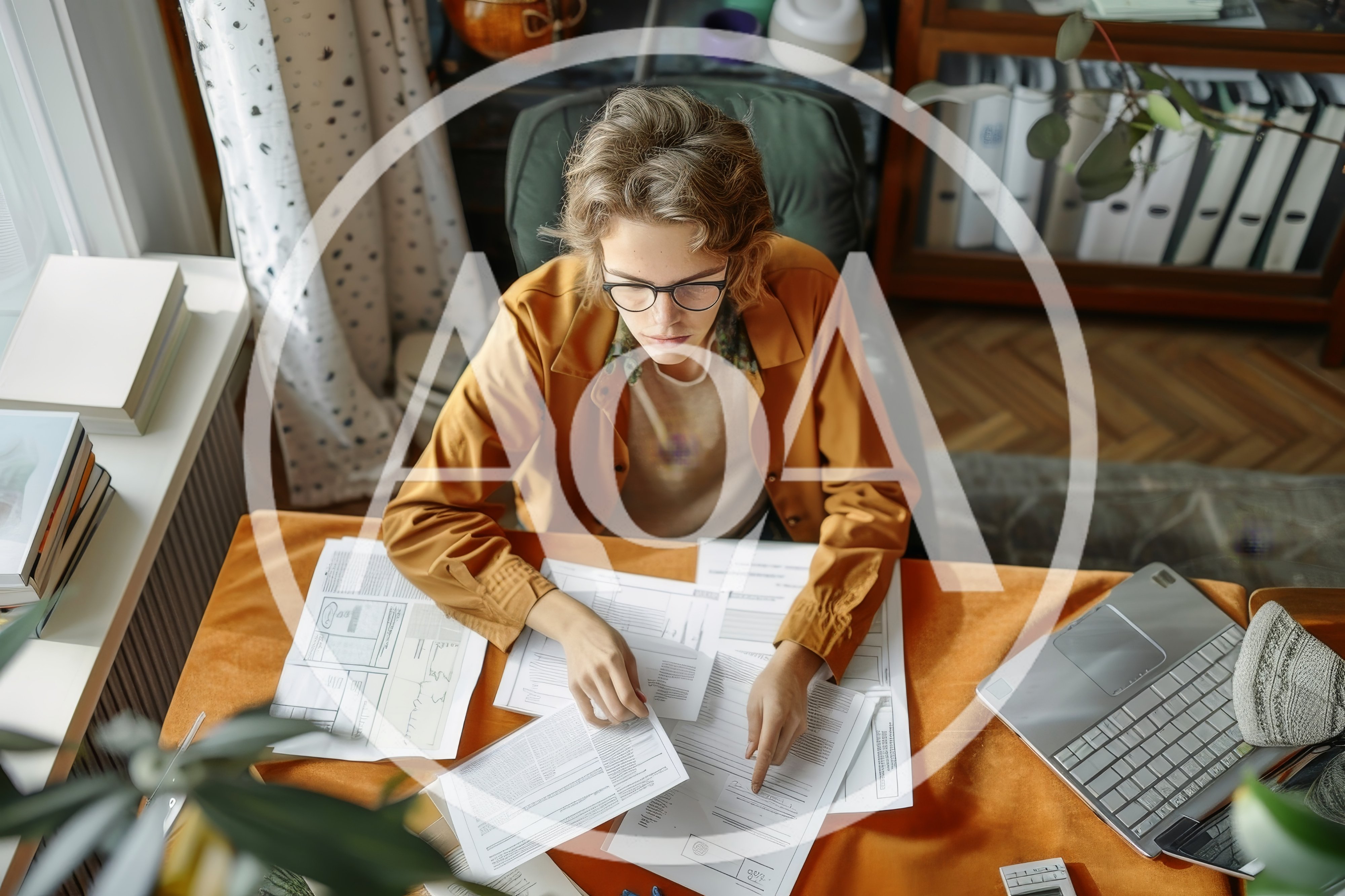 Young Person Working With Documents At Desk