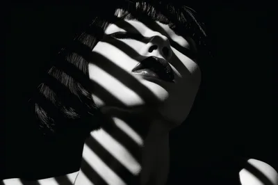 Portrait Of A Woman With Dramatic Shadow Blinds