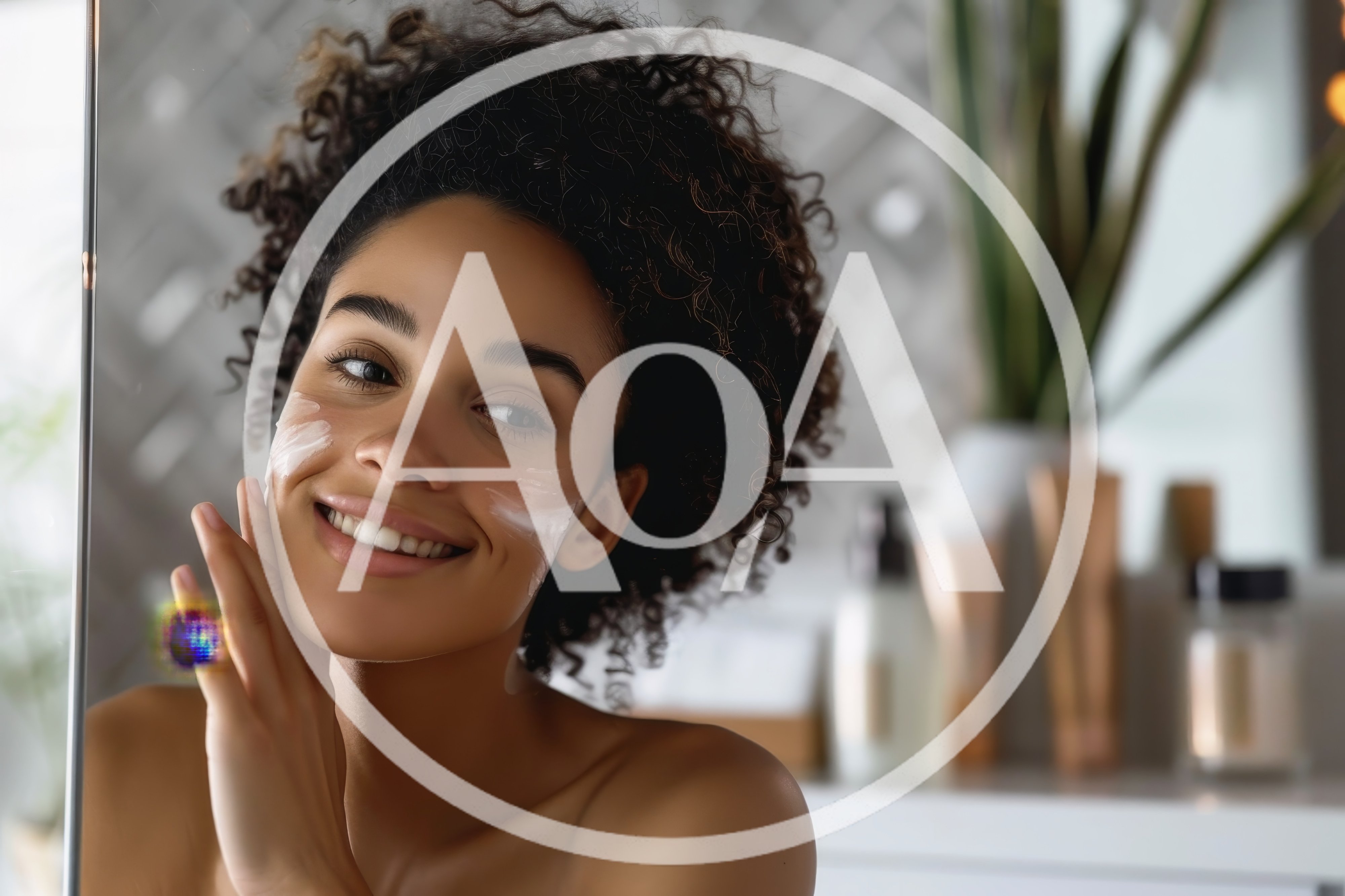 Young Woman Applying Moisturizing Cream To Her Face