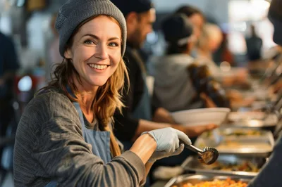 Smiling Volunteer Serving Food at a Community Kitchen
