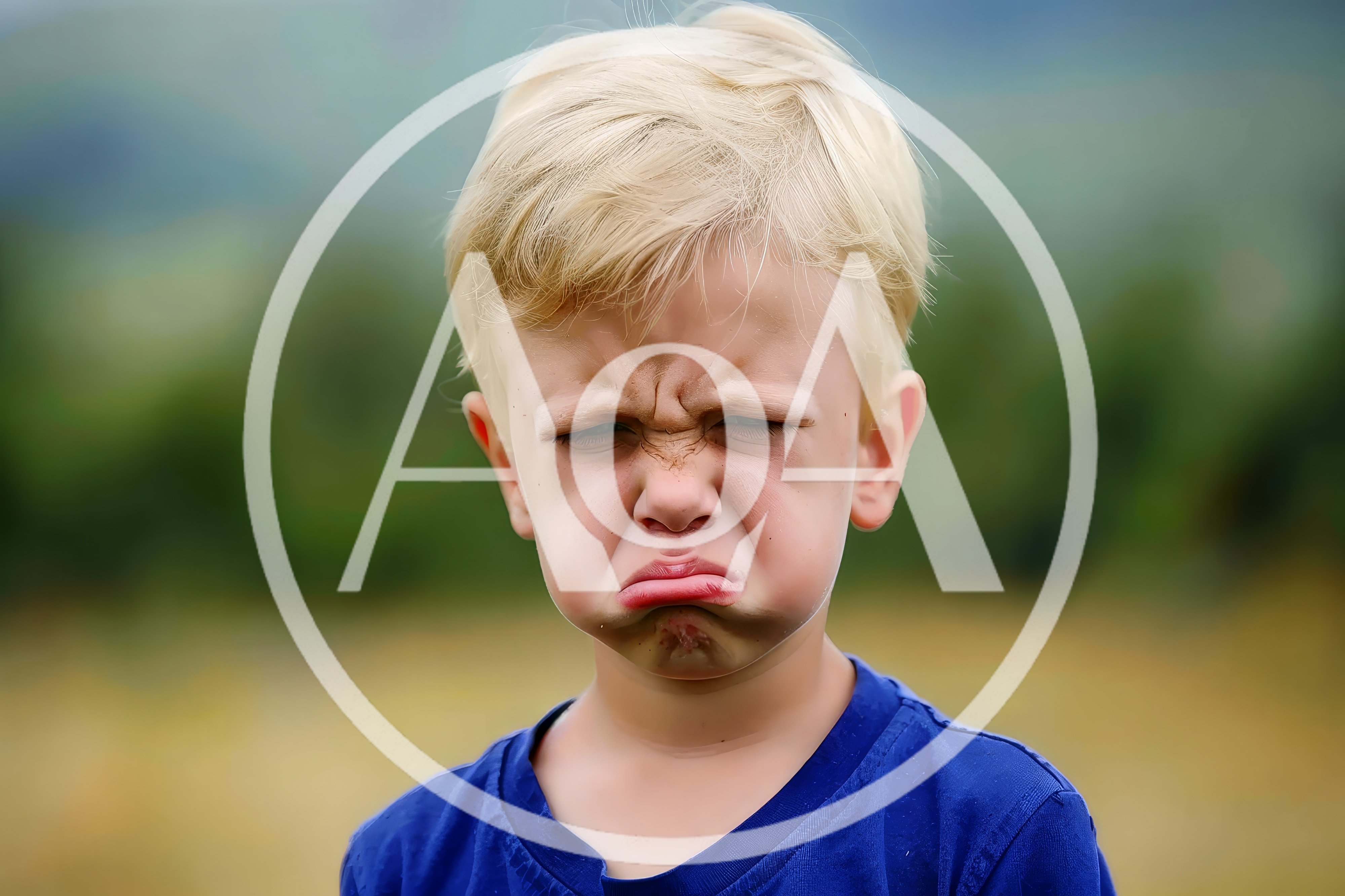 Young Boy Making A Grumpy Pouting Face