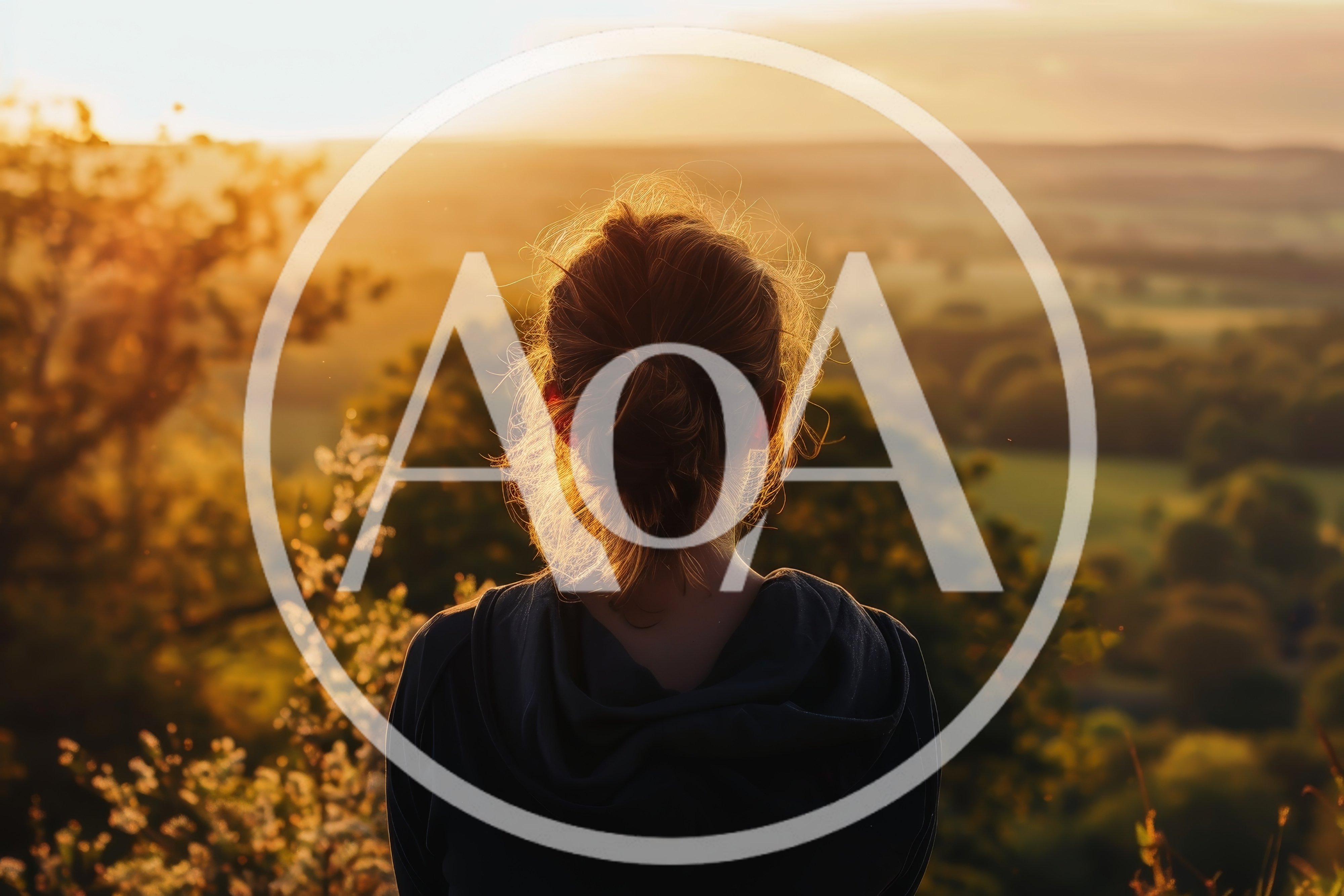 Woman Standing Alone Looking At Sunset Over Landscape