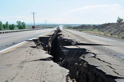 Severe Roadway Collapse and Deep Fissure on Highway