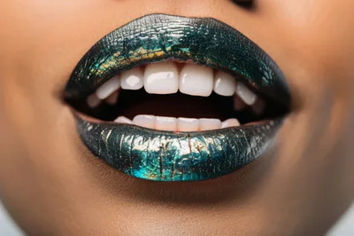 Close Up Of Woman With Metallic Green Lipstick