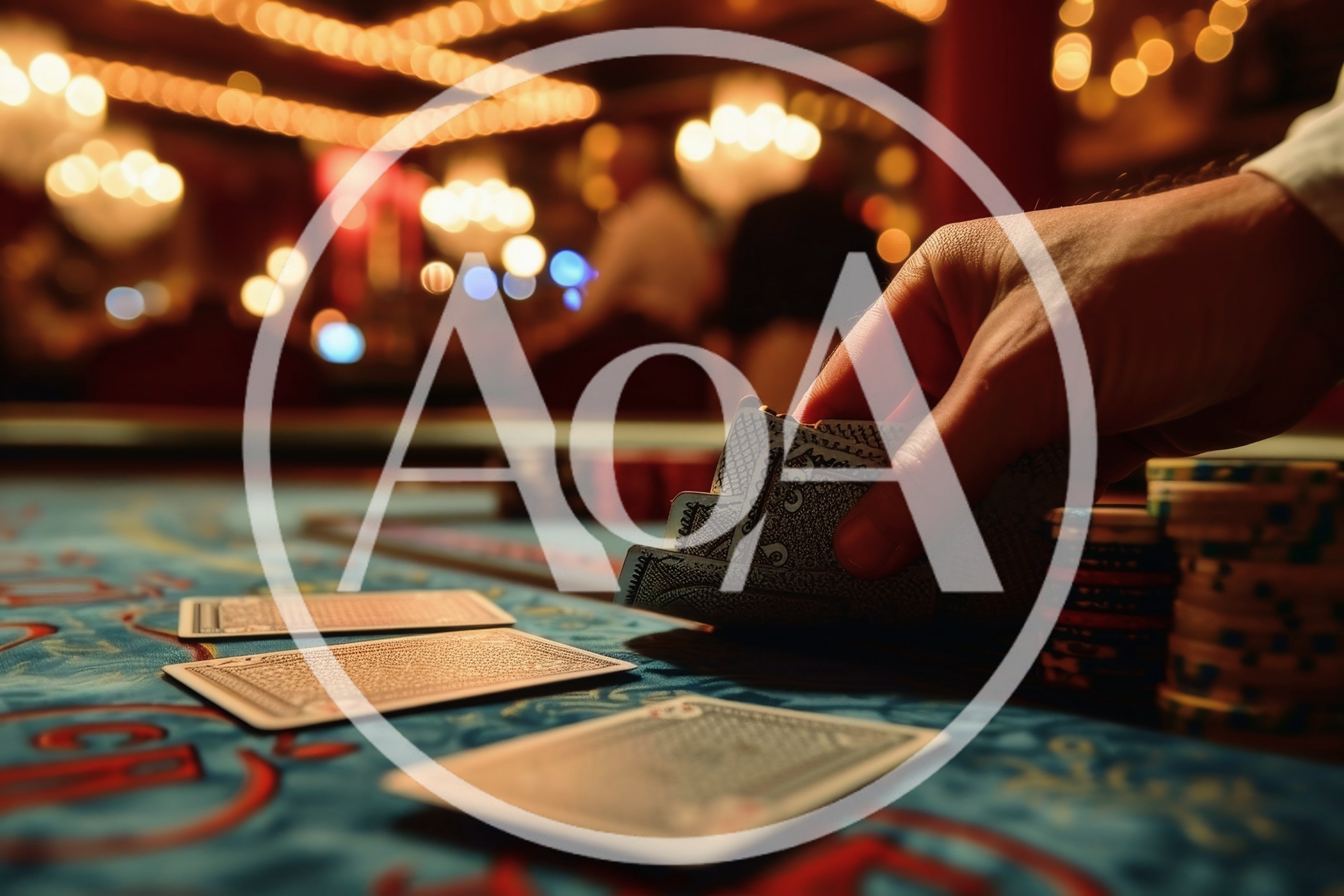 Hand Holding Playing Cards at a Casino Table
