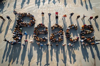 Aerial View Of People Forming The Word Peace