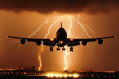 Commercial Airplane Landing During A Dramatic Lightning Storm
