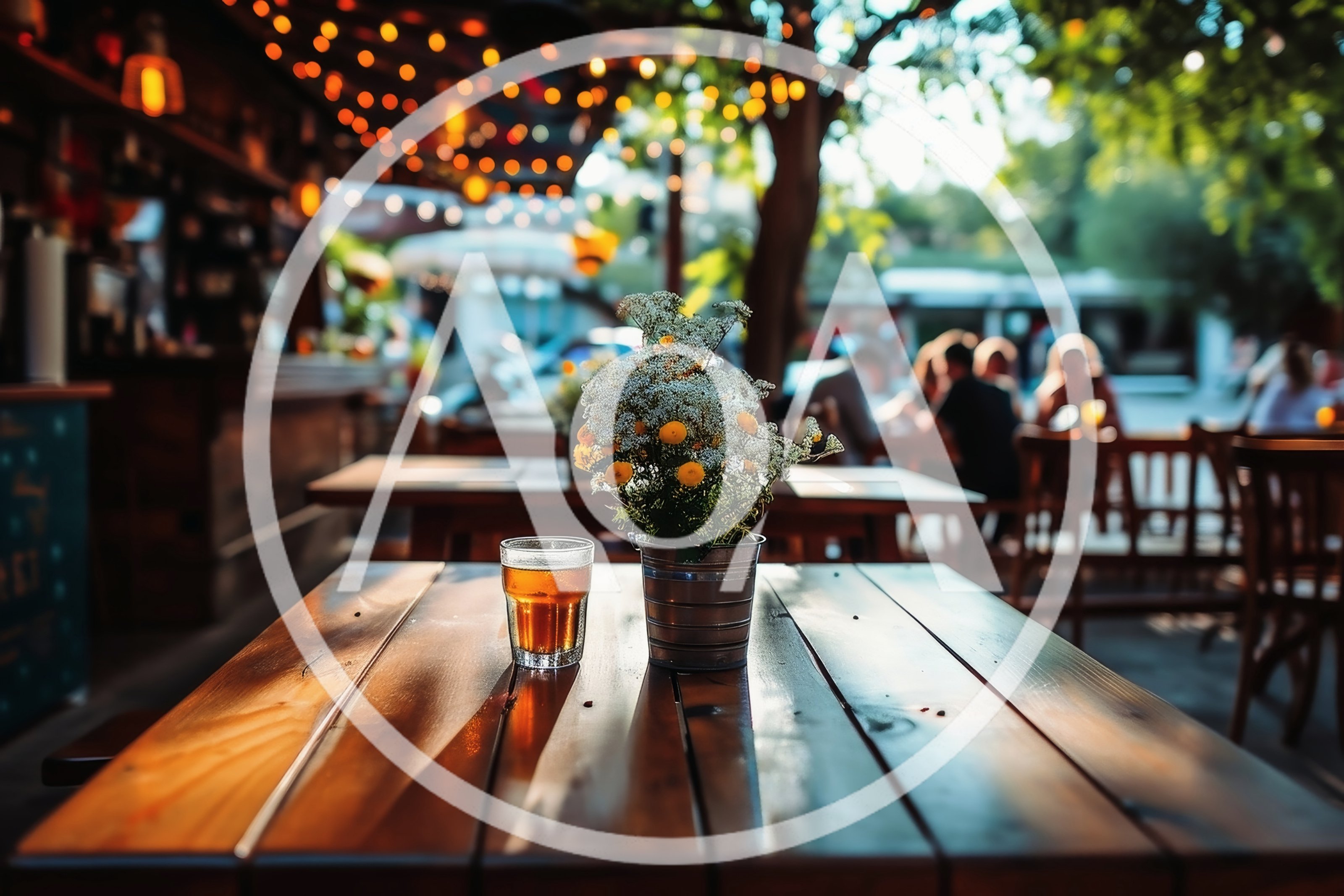 Beer Glass And Flower Pot On Outdoor Restaurant Table
