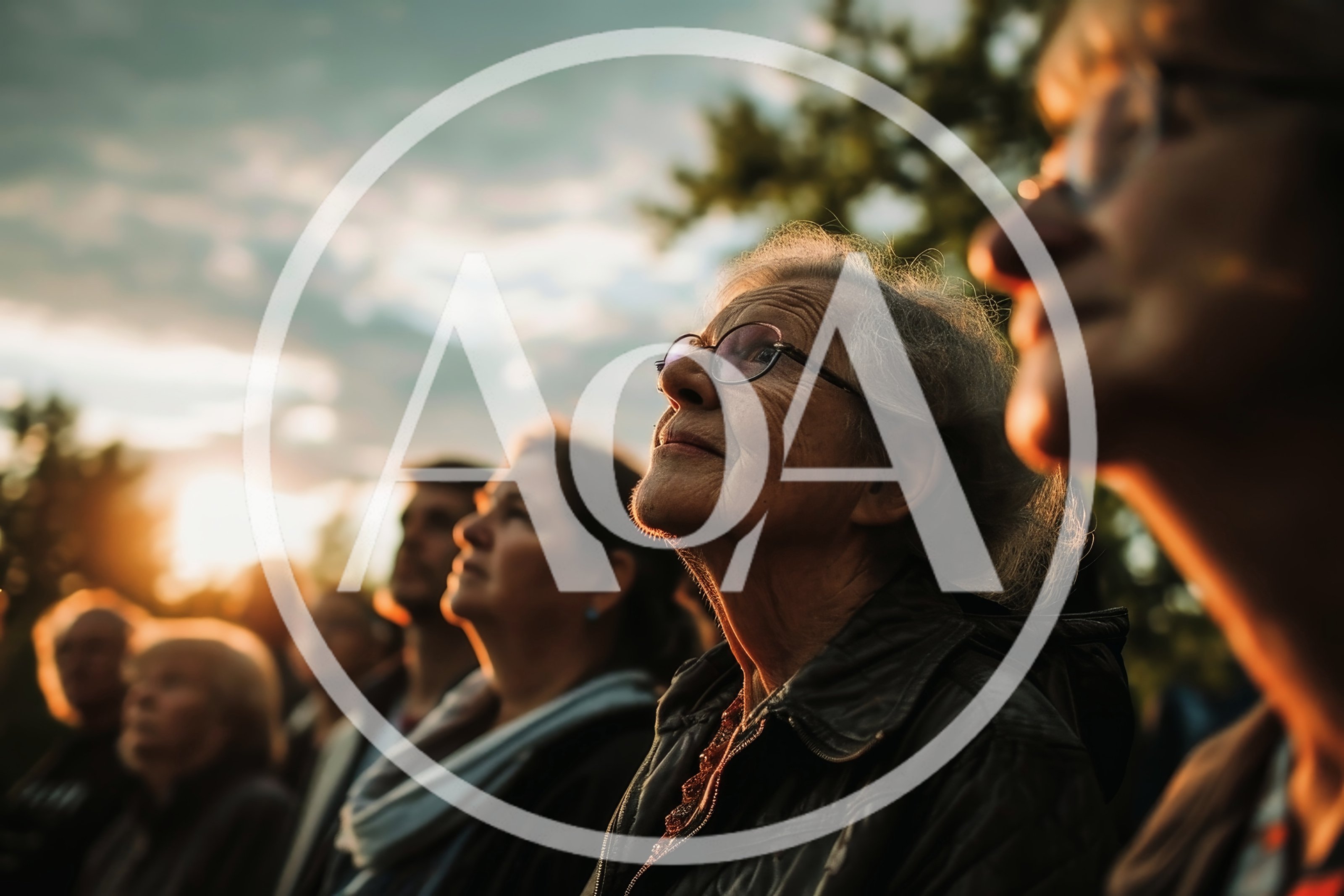 Group Of People Looking Up At Sunset