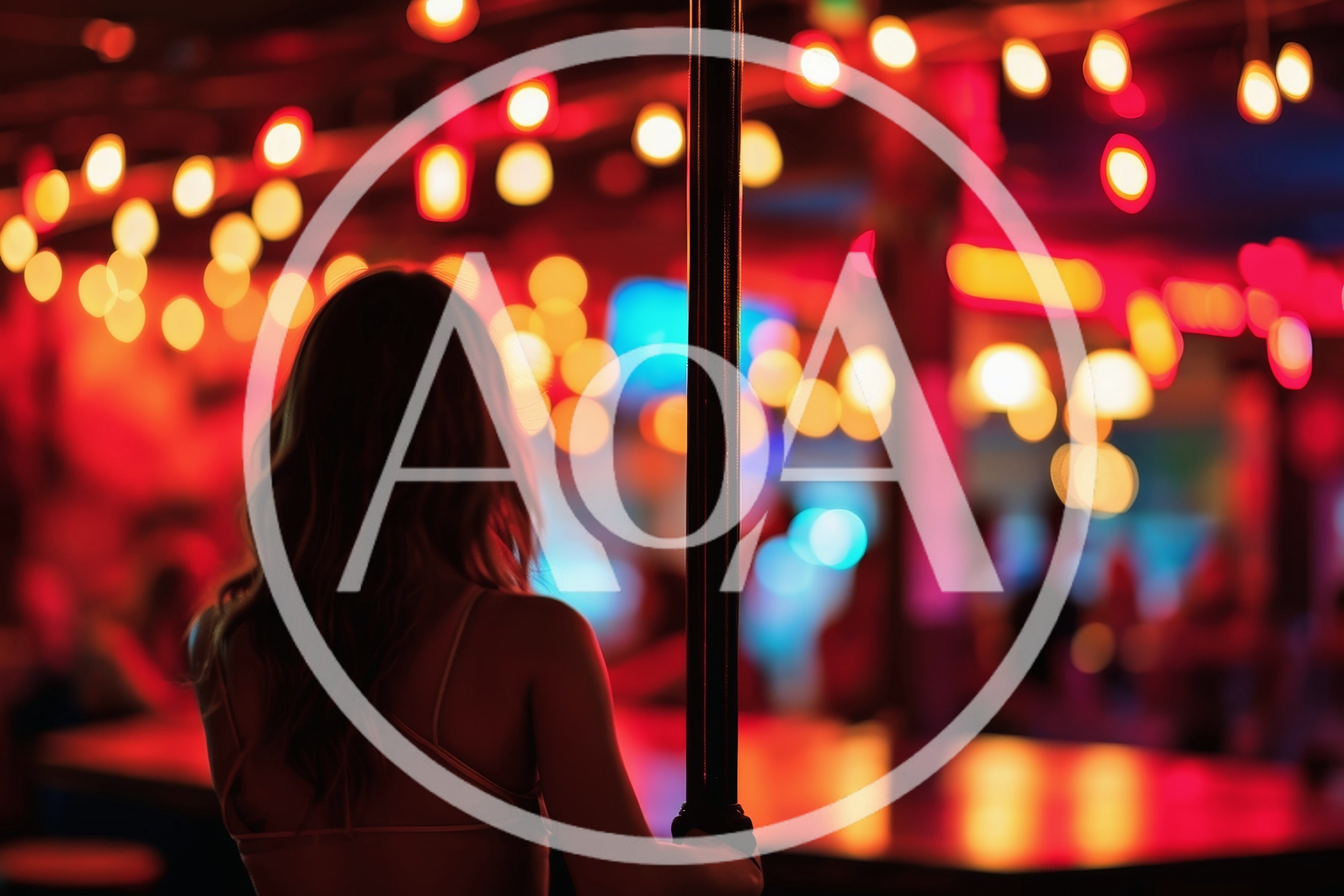 Woman Standing By A Pole In A Nightclub