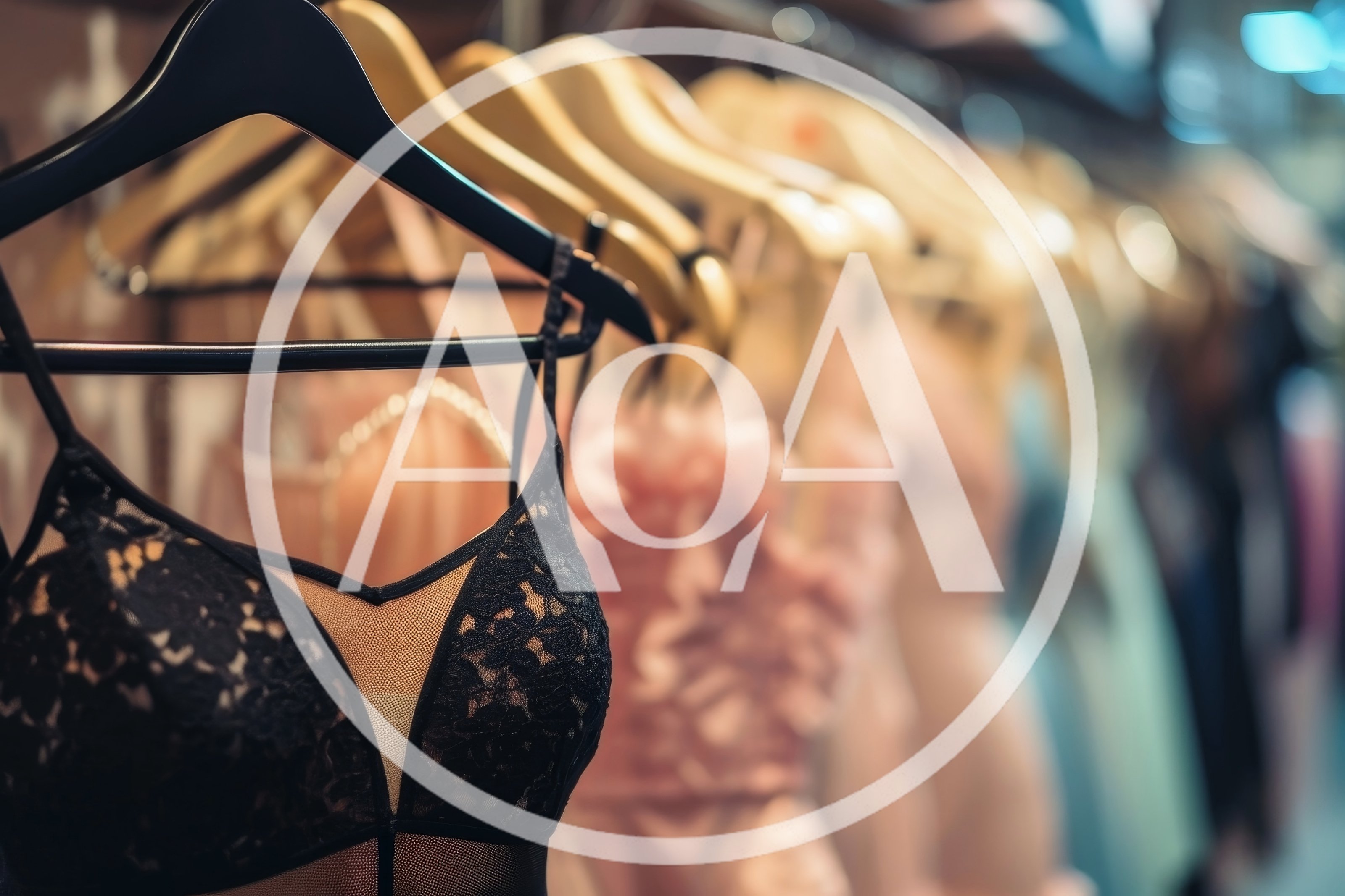 Black Lace Lingerie Bodysuit Hanging On A Clothing Rack