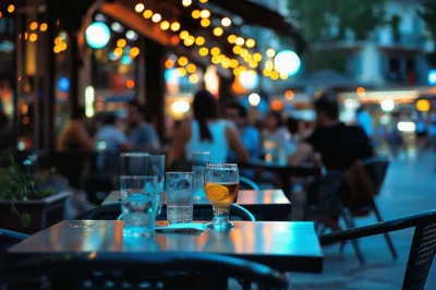 Outdoor Cafe Table With Drinks At Twilight
