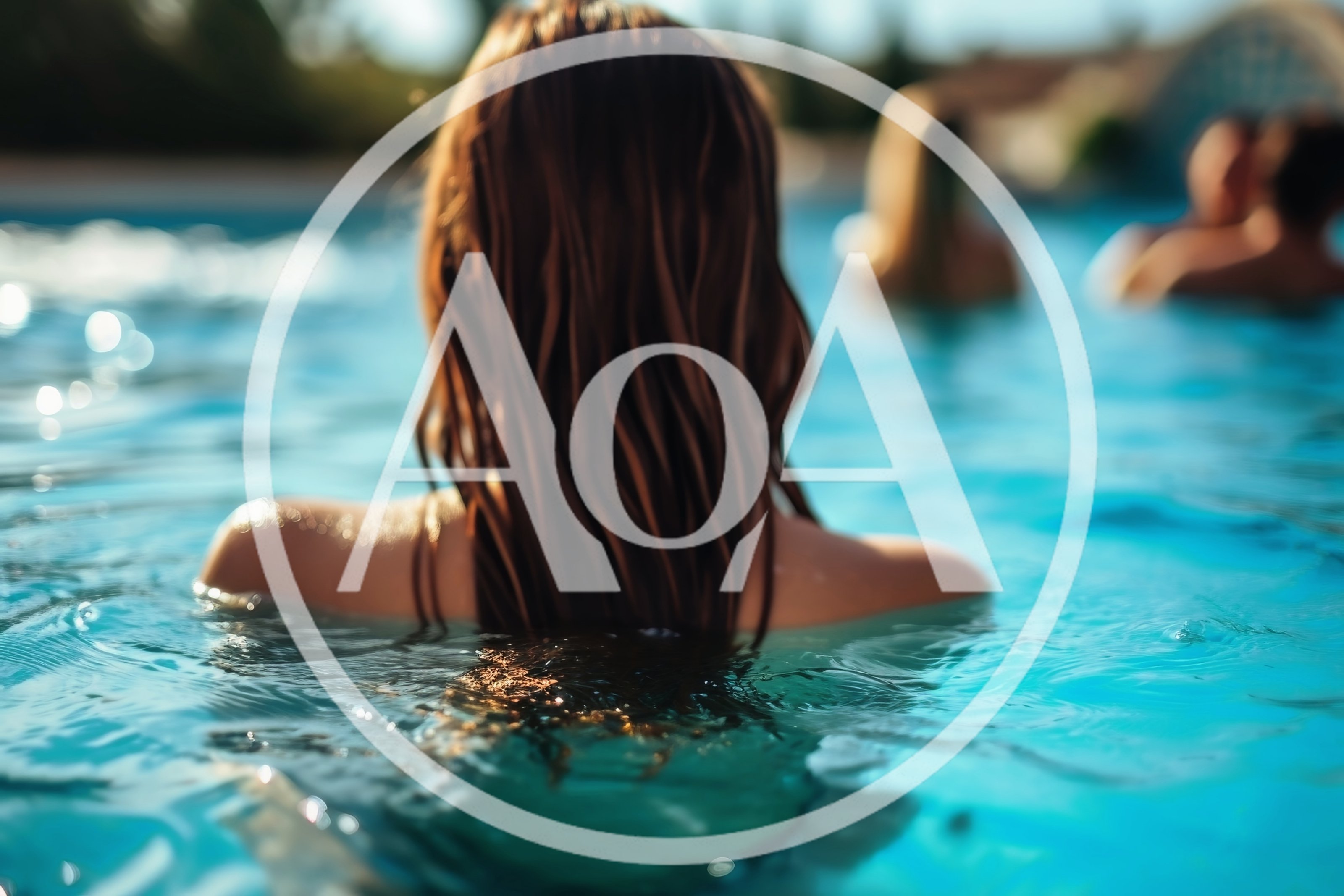 Woman With Long Hair Relaxing In A Swimming Pool