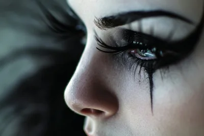 Close Up Portrait Of Woman With Dramatic Gothic Makeup