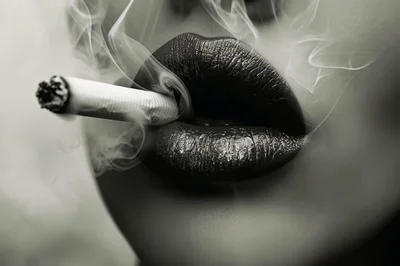Close Up Of Woman Smoking With Metallic Lipstick