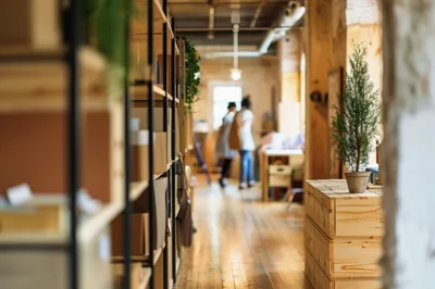 Blurred People Walking Through A Rustic Industrial Office