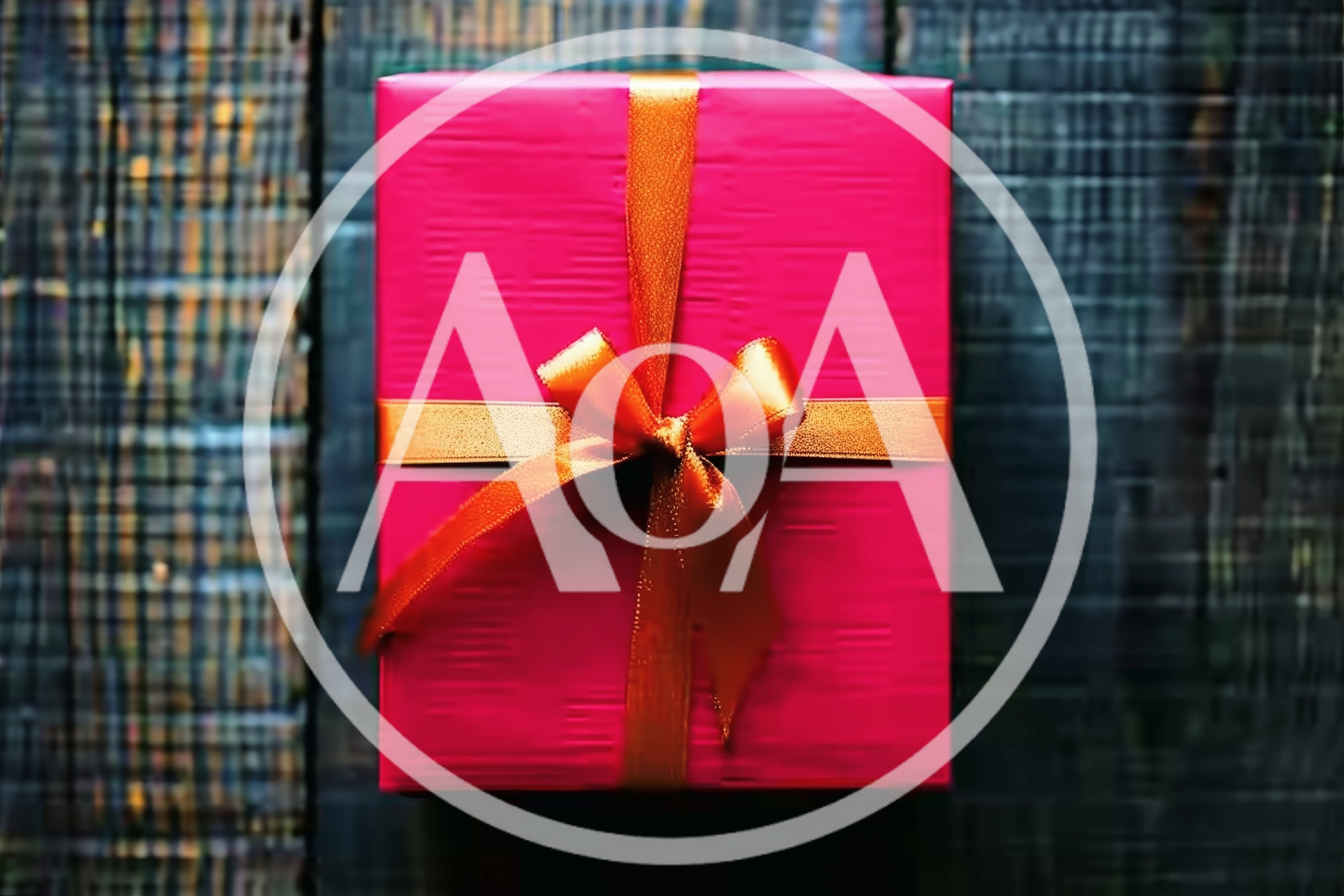 Pink Gift Box With Orange Ribbon On Wooden Background