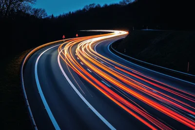 Long Exposure Light Trails On A Winding Highway