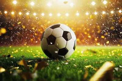 Soccer Ball Resting On Grass With Golden Confetti