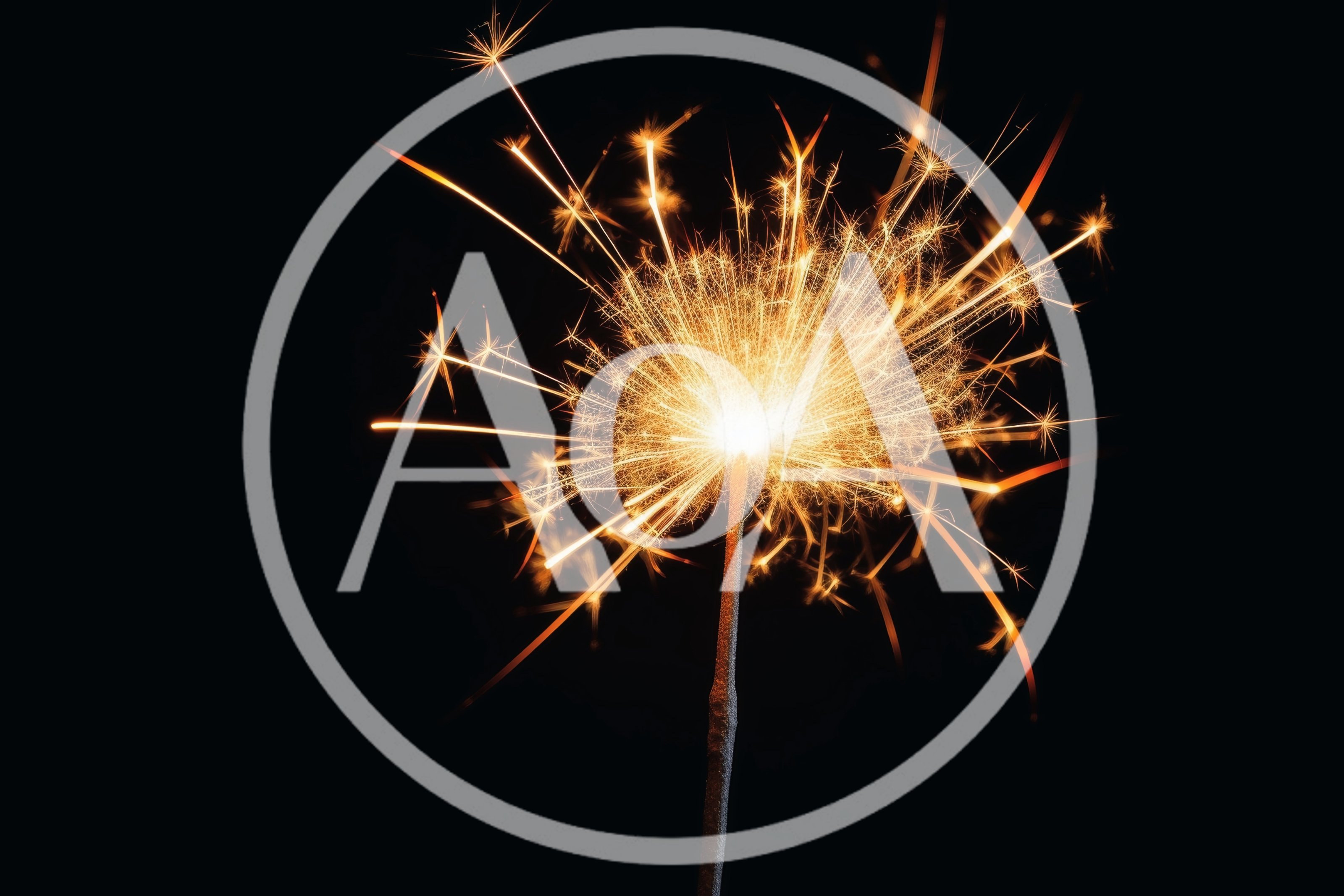 Bright Burning Sparkler Against A Solid Black Background