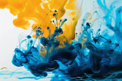 Blue and Yellow Ink Swirling in Water