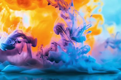 Abstract Blue And Orange Ink Swirls In Water
