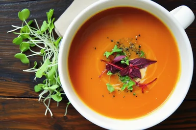 Bowl of Creamy Tomato Soup with Microgreens
