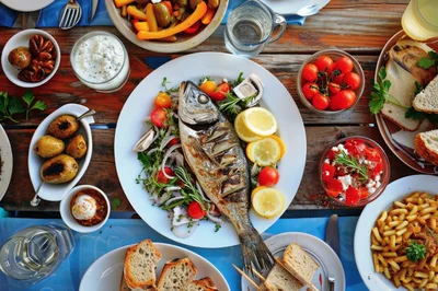 Mediterranean Grilled Fish Platter With Assorted Side Dishes