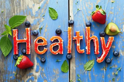 Healthy Word Spelled With Salmon Slices And Fresh Fruit