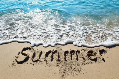 Summer Word Written In The Sand On A Beach